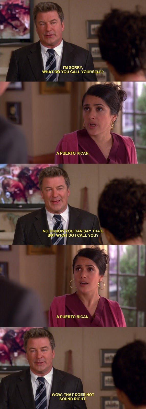 A scene featuring two characters in conversation, Jack and Elisa. Jack, a man in a suit, asks the other, a woman, Elisa, in a purple outfit, what she calls herself. She responds with "a Puerto Rican," but he expresses disbelief, saying it doesn't sound right.  WHAT DO YOU CALL YOURSELF? A PUERTO RICAN. NO, KNOW YOU CAN SAY THAT, BUT WHAT DO I CALL YOU? A PUERTO RICAN. WOW. THAT DOES NOT SOUND RIGHT
