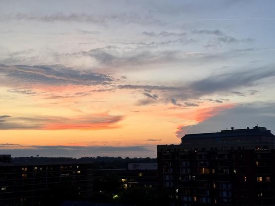 The skyline of Arlington VA as seen from Courthouse. There’s the glow of the sunset, now done, illuminating the clouds