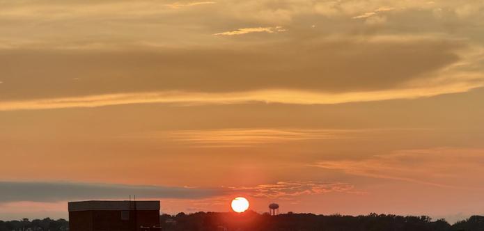 A wide shot of the sunset, similar to the previous shot