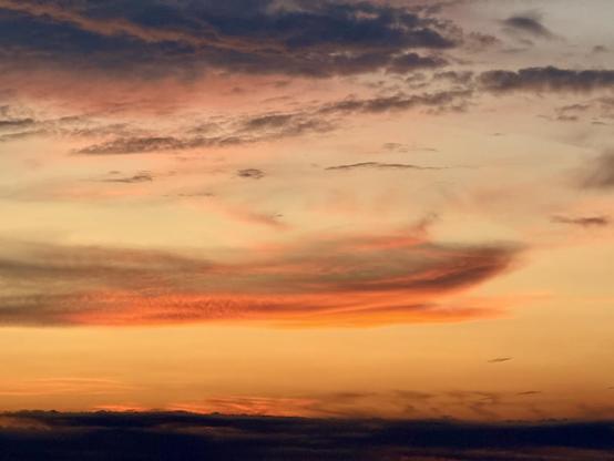 A closer look at one of the clouds illuminated from below by the sunset. 