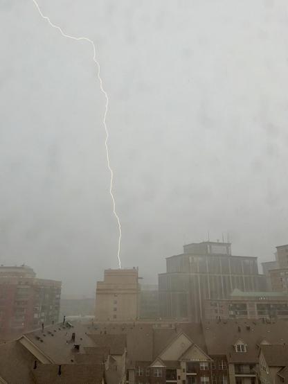 Lightning appears to strike a building near Courthouse in Arlington VA