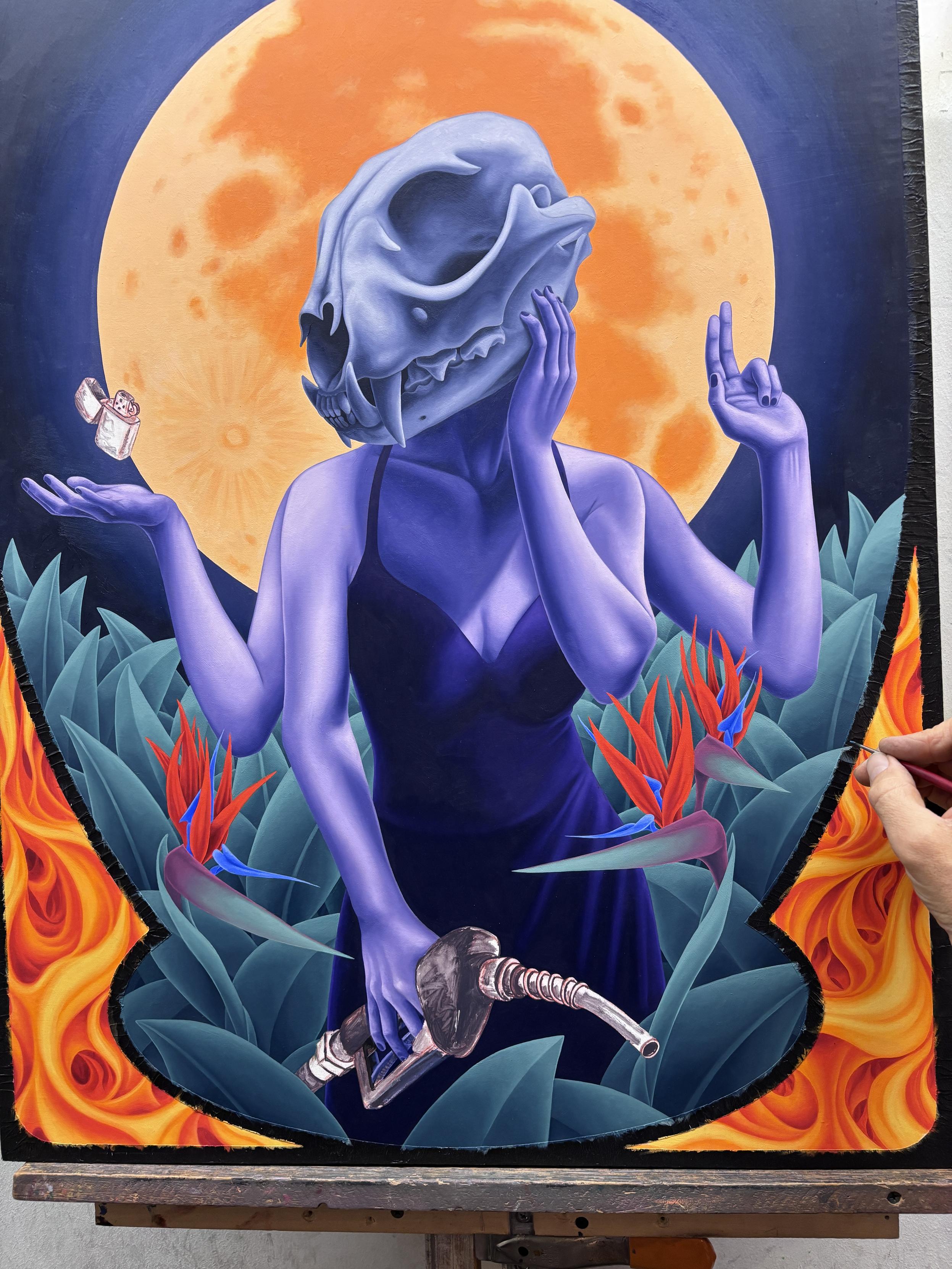 Oil painting in progress of a woman with a lynx skull for a head, with 4 arms. One hand is holding a hose from a gas pump, one hand is on her cheek, one holds up 2 fingers, one is palm up with a zippo lighter floating just above. She is surrounded by plants and bird of paradise flowers. The full moon rises behind her.