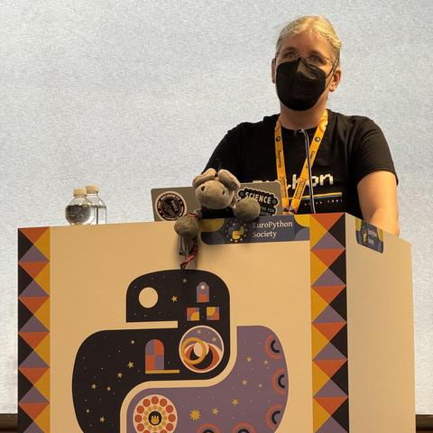 Gina & Timothy on stage at EuroPython