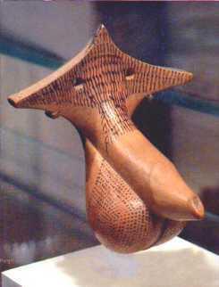 Terracotta vase in the shape of a penis with scrotum and pubic triangle. Pubic hair has been painted on the scrotum too with much loving detail.