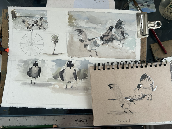 A sheet of watercolor sketches and a sketch pad 