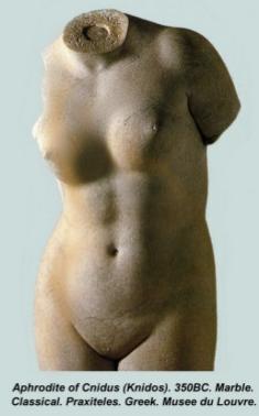 Photograph of the Aphrodite of Cnidus torso. She has a toned belly but her head and arms are missing. A prominent mons veneris draws the gaze.