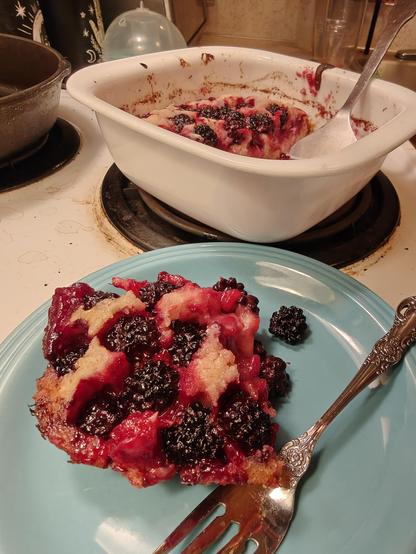 Blue plate with purple cobbler and a fork