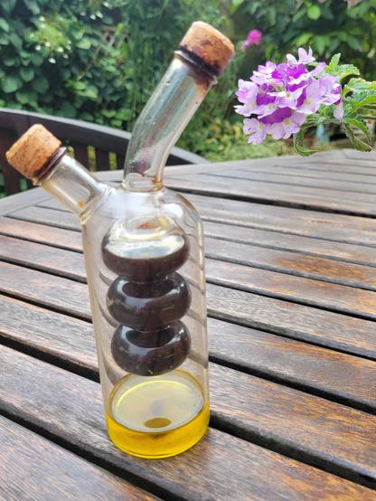 Photograph of oil and vinegar bottle with depleted level of olive oil