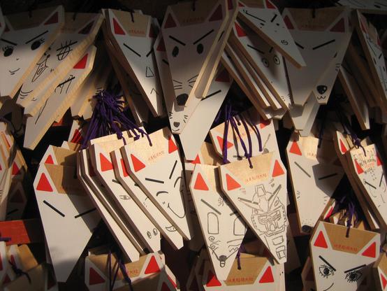 Votive tablets in the shape of fox heads.