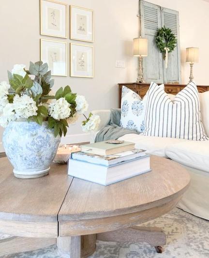 A pretty living room with a lot of light blue and white 