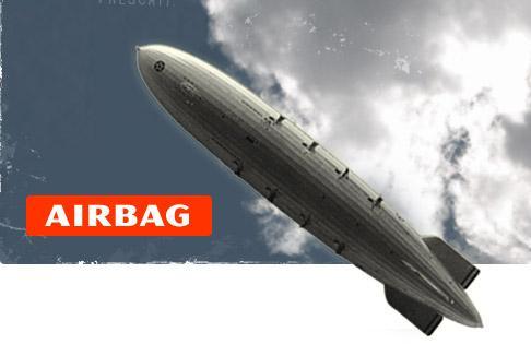 The image features a large, silver-colored airship, resembling a blimp, flying against a backdrop of a blue sky with scattered clouds. The airship is depicted in a diagonal orientation, with its pointed nose at the top left and its tail at the bottom right. The surface of the airship is smooth, with a series of windows or vents running along its side. The word "AIRBAG" is prominently displayed in bold, white letters on a red background at the bottom left corner of the image. The overall color s…