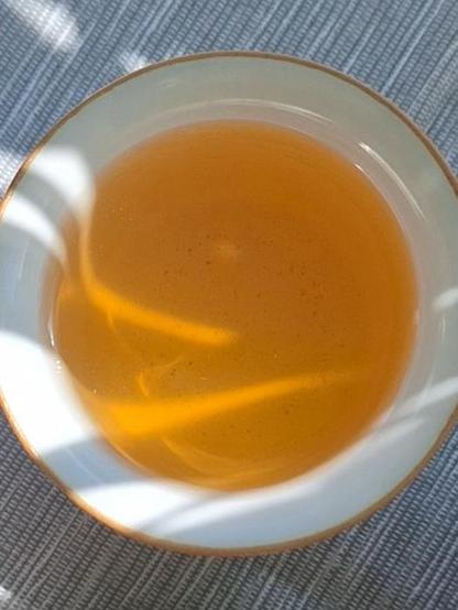 Tea cup with play of shadow and light in the tea
