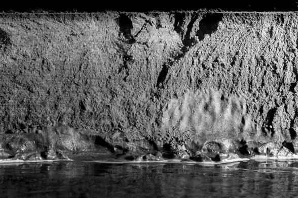 Canyon wall with river below. Monochrome photo 