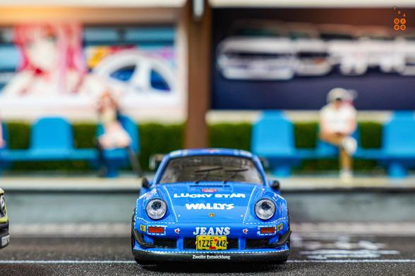 A front side of Porsche RWB 930 Wally's Jeans livery by Tarmac Works in 1:64 scale on AREA 164