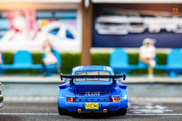 A rear side of Porsche RWB 930 Wally's Jeans livery by Tarmac Works in 1:64 scale on AREA 164