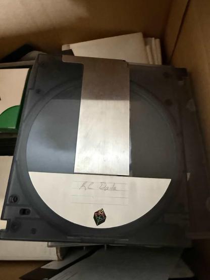 A NeXT magneto-optical "floptical" disc with 256MB of random-access portable storage (from an era of 1.44MB floppy discs). It's labeled "KC Data", and I'm hoping I can still recover some of my archived files from it from the late '80s and early '90s.