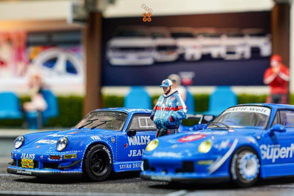 Porsche RWB 930 Wally's Jeans livery and Porsche RWB 993 Supernine by Tarmac Works in 1:64 scale with 1:64 figure on AREA 164