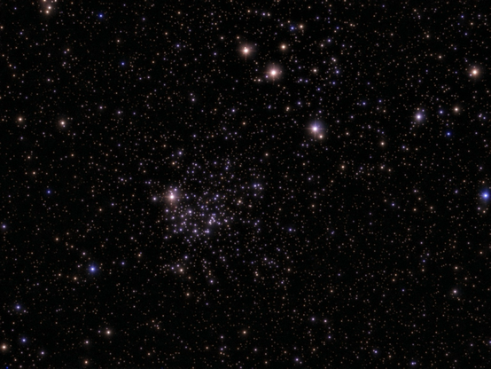 M52 cluster - processed image. M52, also known as the Scorpion Cluster, is a bright open star cluster in Cassiopeia, about 4,600 light-years away, containing hundreds of stars. 