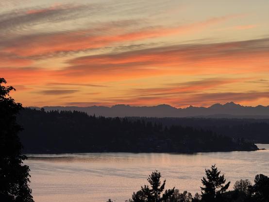 This morning's sunrise over Lake Washington and the Cascades, as seen from Seattle.