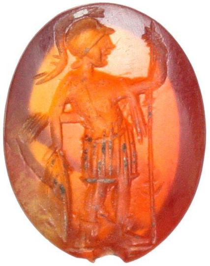 The gemstone depicts Ares-Mars in military dress standing, head left, holding spear and leaning upon a round shield. Slightly convex engraved surface.