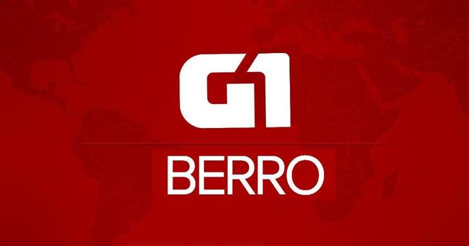Imagem plageando a identidade do portal G1 para notícias urgente. Tem o fundo vermelho com o mapa-mundi e no centro, em cores brancas, e as palavras "G1" e "BERRO".
