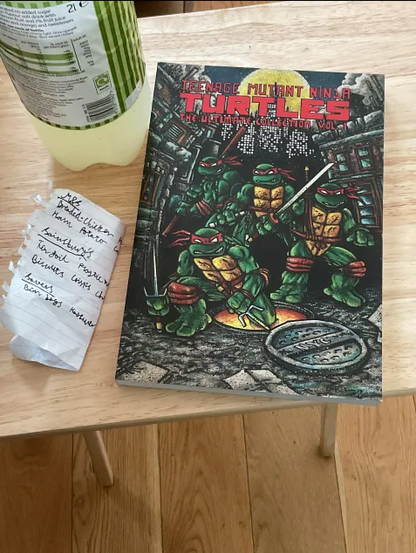Screencap of an honest to God affordable collection of Mirage Comics TMNT comics that can be held in an actual human hand.
