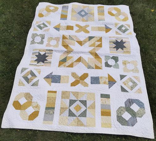 67.5 x 89 cm (171 x 226 cm) a quilt, it is light gold and grey shapes against a light background