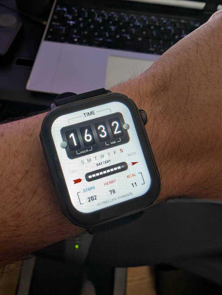 Watch face which looks like an industrial electricity meter.
