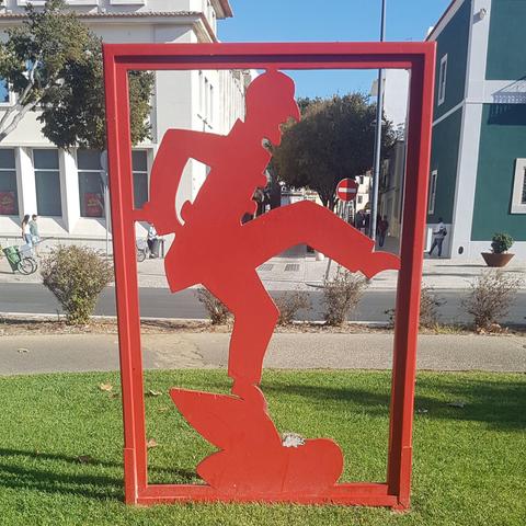 Red metal silhouette sculpture of Hans Christian Andersen at the Setúbal exhibition, 2015.