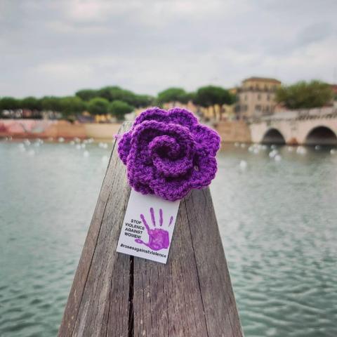 a knittet purple rose in rimini, italy.
stop violence against woman