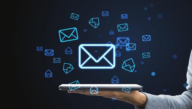 email concept, envelopes hovering above a tablet