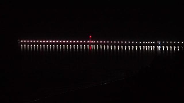 View looking north over Grand Haven beach and its iconic lighthouse and pier jutting into Lake Michigan. // Image captured at: 2025-08-07 05:36:07 UTC (about 1 min. prior to this post) // Current Temp in Grand Haven: 68.01 F | 20.01 C // Precip: clear sky // Wind: N at 0 mph | 0 kph // Humidity: 85%