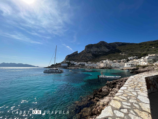 Sailboat in Levanzo Island harbor on a blue sky day