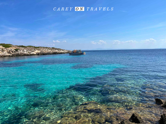 Colorful waters and boat off of Levanzo Island Sicily