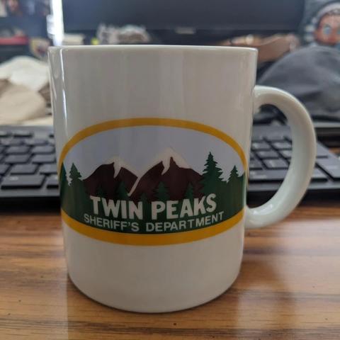Mug with Twin Peaks logo of snow-capped mountains and trees, with the words Twin Peaks Sheriff's Department.