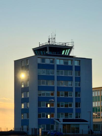 The sun shines through a window at the Hotel Natura, which also has a the RKV airport control tower on top of it