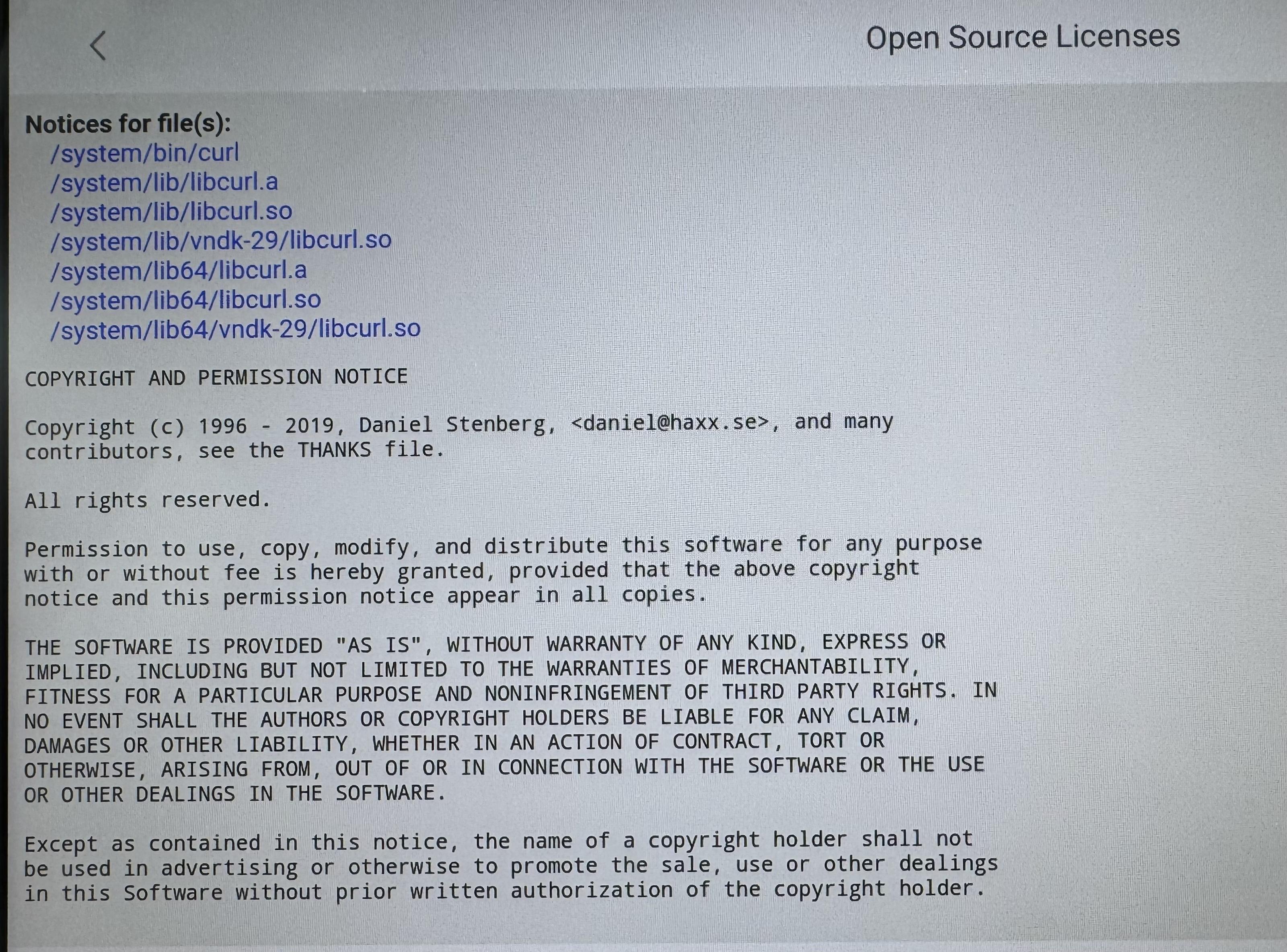 Photo of BYD car screen showing curl/libcurl components and associated license