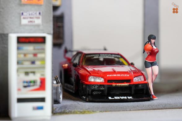 A basketball girl and Nissan Skyline LB-ER34 Super Silhouette by Mini GT in 1:64 scale on AREA 164
