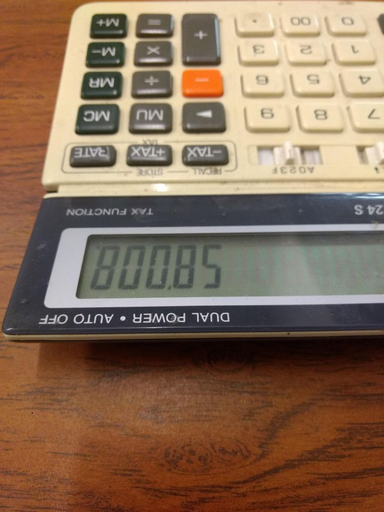 Old-timey calculator with digits which upside down spell out "BOOBS"