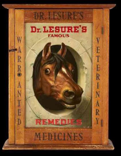 Antique wooden cabinet advertising Dr. Lesure's Famous Veterinary Remedies and Medicines, featuring a painted horse head.