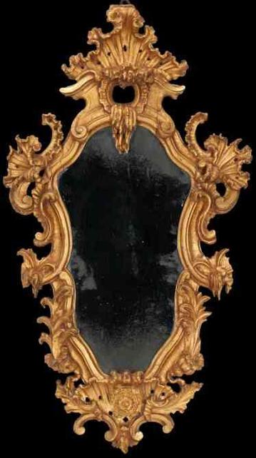Ornate gold rococo mirror with a dark, reflective surface.