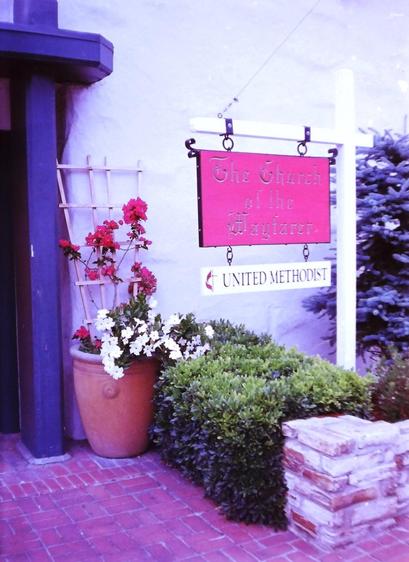 Flowers and red church sign