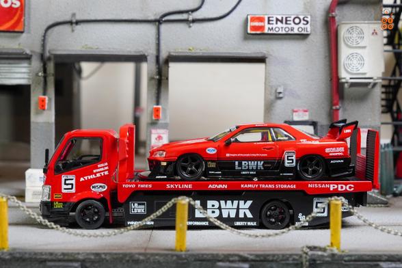 A Nissan Skyline LB-ER34 Super Silhouette by Mini GT and a Custom Tow Truck, LB Super Silhouette by Micro Turbo in 1:64 scale on AREA 164