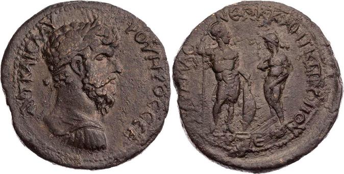 Tetrassarion coin with a brown patina depicting Ares in armour with helmet, spear, and shield and Aphrodite with a hand over her breasts and vulva.