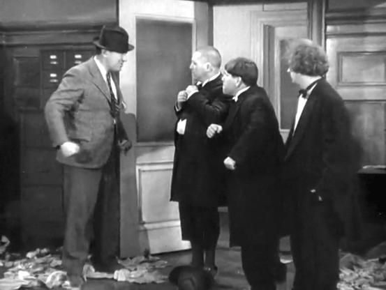 Ted Healy confronting the #threestooges (Curly, Larry, Moe) in a scene from "The Big Idea"