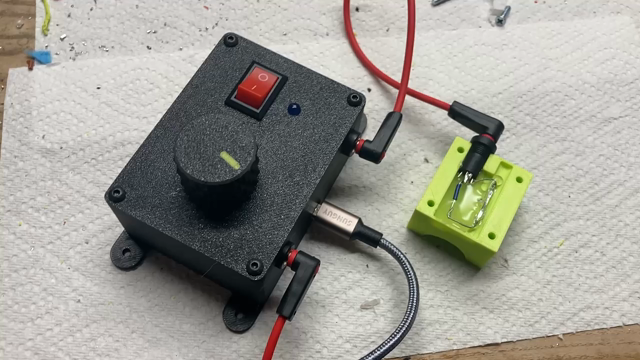 A video showing a microcontroller with an LED being triggered by a red switch and a magnet.