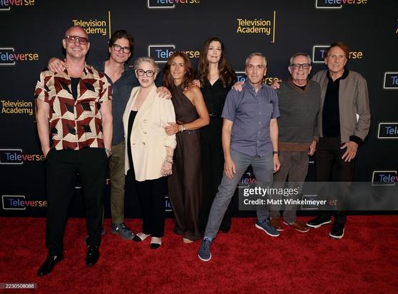 The Queer as Folk Cast on the red carpet posing for the cameras.