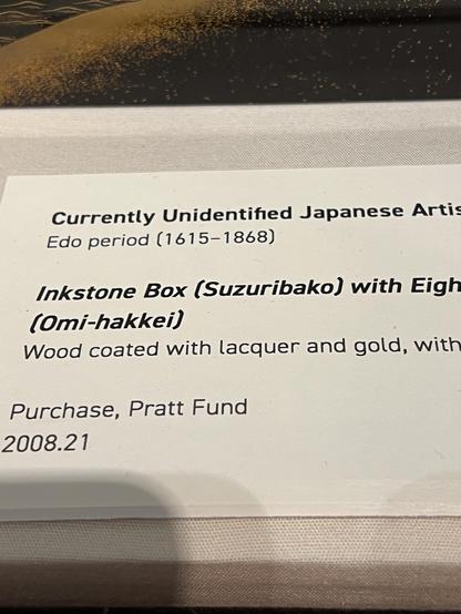 description of the lacquered box, saying it’s from the Edo period (1615-1868) and that it’s wood coated with lacquer and gold, by an unidentified artist