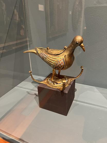 this is a dove covered in enamel from Limoges, FR, made in the 1200’s. the back of the dove opens, and has a small chamber which would have held communion wafers. it appears to be life-sized. 