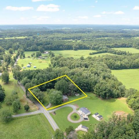 aerial photo of brick home displaying the property parameters.